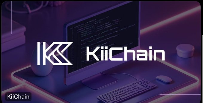 The image features a computer monitor displaying the text "IKICHAIN" along with a keyboard and mouse nearby. The background of the image shows a purple neon light strip, which could be an advertisement or promotional material for the company. The caption reads "Just finished listening to the 'Road To The New Era of Payments' space with @KiiChainio and Danyel Arenas". This suggests that the image is related to a discussion about cryptocurrency or payments in general, possibly featuring a new technology or innovation within the industry.