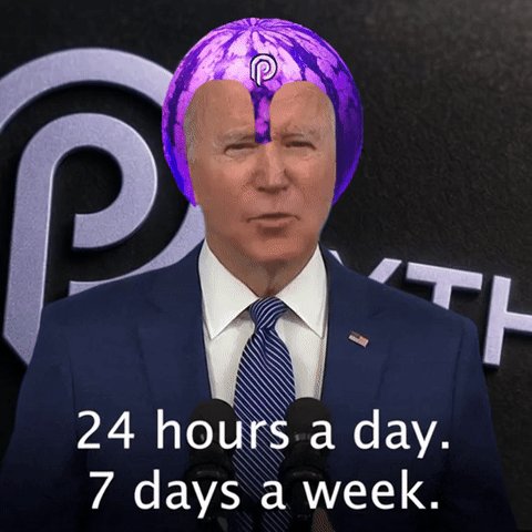 The image features a man wearing a purple hat with a watermelon design sitting behind him as he speaks into a microphone. The caption below his speech reads "24 hours a day, 7 days a week." This suggests that the man is giving a speech or presentation at some point during the week of the caption's creation.