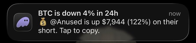 The image shows a Phantom wallet notification stating "BTC is down 4% in 24h" alongside an advertisement claiming "@Anused is up $7,944 (122%) on their short. Tap to copy," which highlights how the wallet is promoting copy trading by showcasing a user's profitable short position amid a market dip.