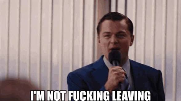 Meme featuring Leonardo DiCaprio as Jordan Belfort from 'The Wolf of Wall Street' with the caption 'I'M NOT FUCKING LEAVING'.