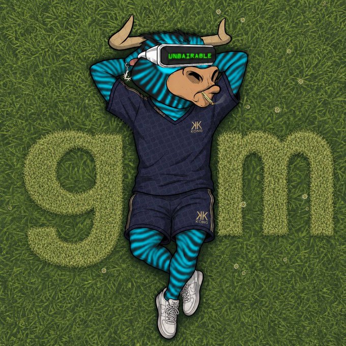 A relaxed cartoon bull in a blue "KONG" outfit lounges on grass with the letters "e" and "m" cut from the turf flanking him, wearing a VR headset labeled "UNBAIRAABLE" while a cigar dangles from his mouth—fitting the bullish "GM frens" vibe of the post.