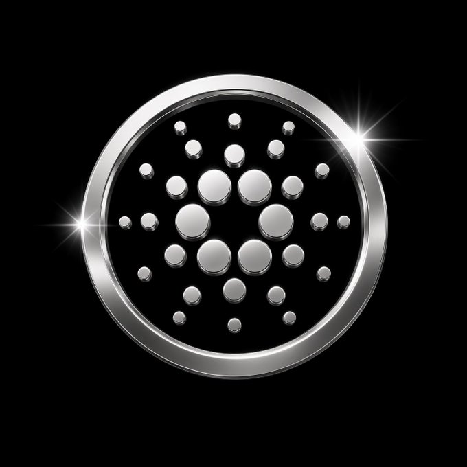 A silver coin emblem with a dotted circular pattern shines against a black background, visually representing the $TSLVR tokenized silver asset now available on the Cardano ($ADA) mainnet through L4VA.