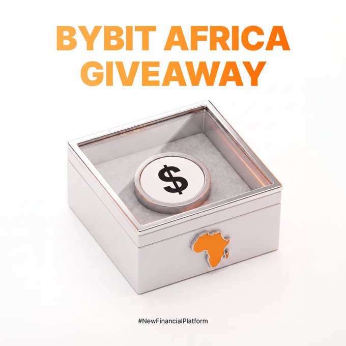 The image shows a silver gift box with a glass top displaying a coin marked with a dollar sign, accompanied by an orange Africa continent icon and the bold orange text "BYBIT AFRICA GIVEAWAY" at the top, with the hashtag "#NewFinancialPlatform" at the bottom—visually representing the $500 giveaway prize being offered to 10 ByBuddies as part of the Bybit Africa promotional campaign running July 17th–24th, 2026.