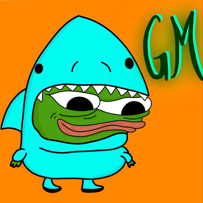 A cartoon illustration of a turquoise shark character with a Pepe the Frog face inside its open mouth, accompanied by the letters "GM" on an orange background.