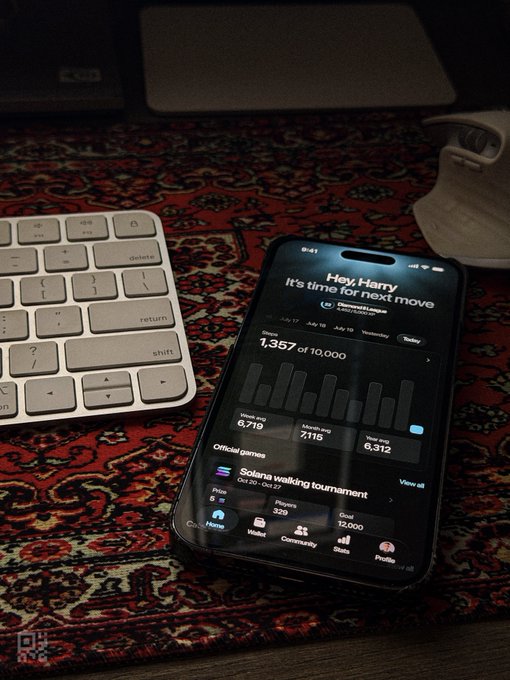 A smartphone displaying the Game of the Day chess app on a patterned rug next to a keyboard, showing 'Hey, Harry. It's time for next move' with a rating of 1,357.