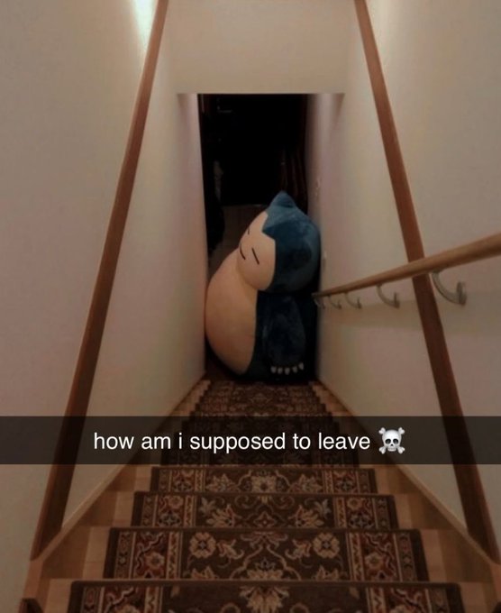 A large plush figure in a blue hooded cloak sitting at the top of a carpeted staircase, blocking the path, with the caption 'how am i supposed to leave' and a skull emoji.