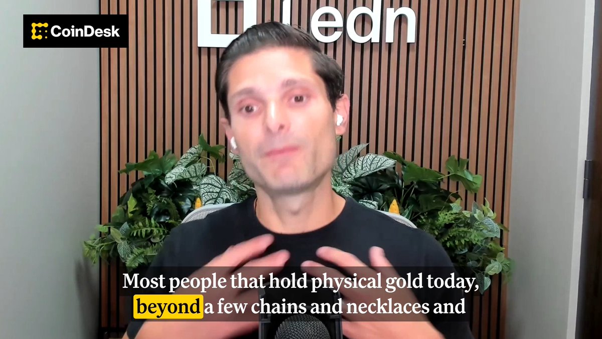 A man wearing earbuds speaks during a CoinDesk video interview, with "ledn" visible on the wood-paneled wall behind him. Captioned subtitles read: "Most people that hold physical gold today, beyond a few chains and necklaces and"—referencing his argument about the limitations of physical gold versus tokenized alternatives.