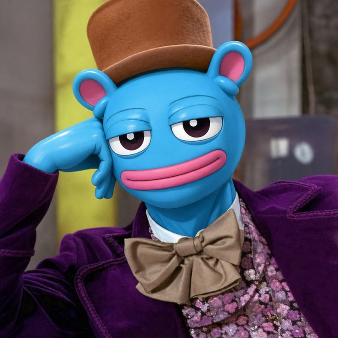 A blue bear character wearing a small brown top hat, a purple corduroy jacket, and a tan bow tie over a floral shirt, resting its head on its hand.