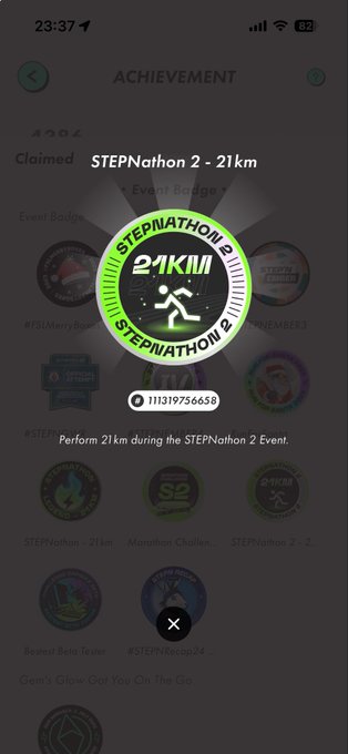 A smartphone screenshot of a fitness achievement screen showing a claimed 'STEPNathon 2 - 21km' event badge with the description 'Perform 21km during the STEPnathon 2 Event.'