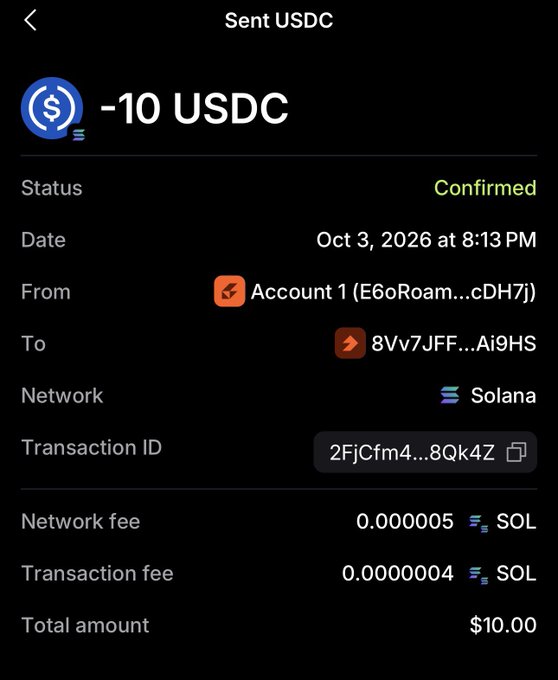 A mobile wallet app screen showing a confirmed transaction of -10 USDC sent on Oct 3, 2026, via the Solana network with minimal network and transaction fees.