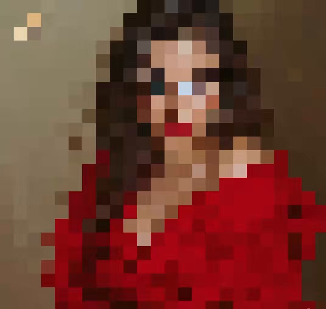 The image features a woman wearing a red dress, with her face blurred out for privacy reasons. The background of the photo appears to be a brown wall or canvas, which contrasts nicely with the vibrant red color of the woman's dress. There is also an image of a person in the background that seems to be a logo or a symbol related to Art by J.