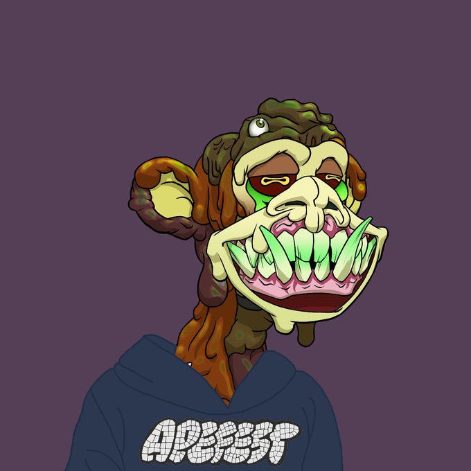 The image features a cartoon monkey wearing a hoodie with white text on it. The monkey has a face painted on its head, giving it a unique appearance. The background of the image is purple, which contrasts with the brown fur of the monkey. There are no other objects or texts in the image, and the monkey appears to be looking directly at the camera. The caption "GM, who’s ready for that ApeFest announcement?" suggests that there might be an upcoming event related to the cartoon character or a promotional post featuring the monkey.