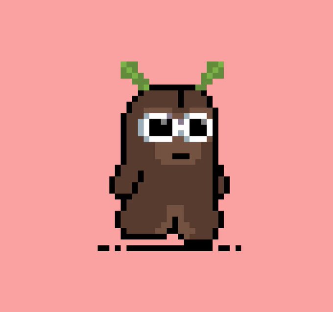 A pixel art illustration shows a small brown, creature with green sprout-like antennae, wearing large glasses and sitting against a pink background. The image pairs with the caption "G'chode" as a whimsical meme character.