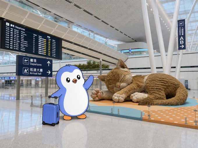 A scene at an airport departures hall featuring a large sleeping cat sculpture alongside a cartoon blue penguin mascot with a blue suitcase, with signs indicating 'Departures' and 'Arrival hall' in both Chinese and English.