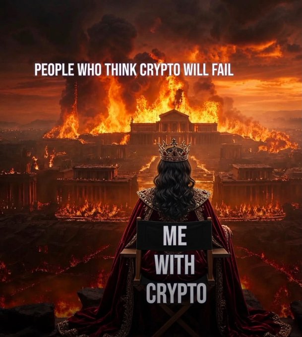 A regal figure wearing a crown sits calmly in a director's chair before a burning cityscape, with text reading "PEOPLE WHO THINK CRYPTO WILL FAIL" above the flames and "ME WITH CRYPTO" on the chair back. The image visually reinforces the post's message of steadfast conviction, portraying the crypto holder as an unshaken monarch watching critics' predictions go up in smoke while they remain comfortably in control.