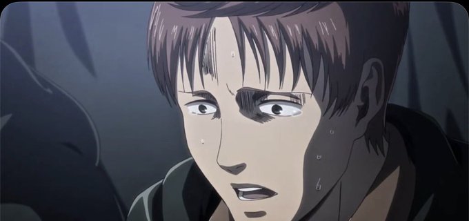 A close-up anime screenshot shows a brown-haired male character with wide, fearful eyes and sweat drops on his face, looking shocked in a dimly lit scene.