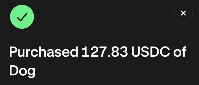 A dark-themed confirmation screen displays a green checkmark icon alongside the message "Purchased 127.83 USDC of Dog," indicating a successful cryptocurrency transaction celebrating the post's "$DOG Day" theme.
