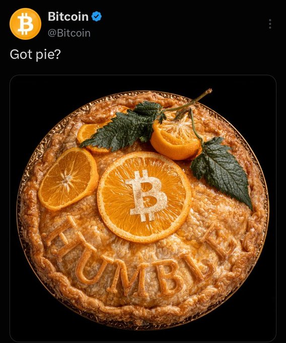 A tweet from the verified Bitcoin account (@Bitcoin) reads 'Got pie?' above an image of a pie decorated with orange slices, a Bitcoin logo, and the word 'HUMBLE' spelled out in crust.