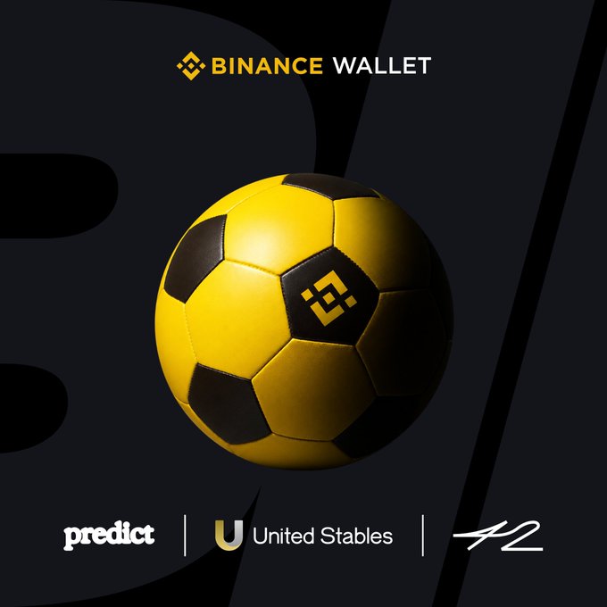 The image features a soccer ball with a "Binance Wallet" logo, which is associated with the "United Stables" company. The background of the image is black, making the yellow soccer ball stand out prominently. The text on the image includes the words "Binance Wallet", "United Stables", and "42space/join/iDXxmD8".
