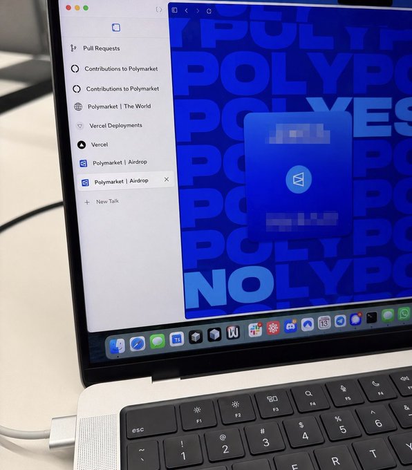 A MacBook displays a browser with a Polymarket Airdrop tab open alongside a blue Polymarket-themed desktop wallpaper, visually reinforcing the claim that Polymarket's help center still denies a token or airdrop while evidence of $POLY and an upcoming airdrop mounts behind the scenes.