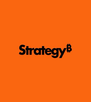 The image features an orange background with black text that reads "Strategy" followed by " bitcoin". The text is centered, making it easy to read. Below this, there's a gray line running down the center of the image. The main focus of the image is on the words "strategy" and "bitcoin", which are both in black against the orange background.
