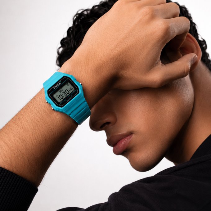 The Fhenix branded digital watch, showing the time 10:30:46, is featured on a person's wrist, perfectly illustrating the "early" theme for the Fhenix swag shop.