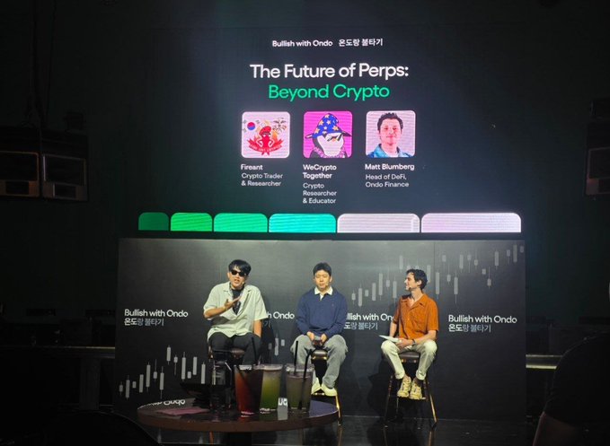 Three panelists sit on stools on a stage during the 'Bullish with Ondo 온도랑 불리기' event, with a large screen behind them displaying the panel title 'The Future of Perps: Beyond Crypto' and introducing speakers 'Fireant (Crypto Trader & Researcher)', 'WeCrypto Together (Crypto Researcher & Educator)', and 'Mart Blumberg (Head of DeFi, Ondo Finance)'. The backdrop features 'Bullish with Ondo' branding alongside candlestick chart graphics.