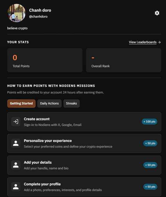A dark-themed profile dashboard shows user @chanhdoro with a "believe crypto" tagline, displaying 0 Total Points and an unranked Overall Rank. Below, under "HOW TO EARN POINTS WITH NODIENS MISSIONS," various onboarding tasks are listed with point rewards: Create account (+100 pts), Personalize your experience (+50 pts), Add your details (+50 pts), and Complete your profile (+50 pts), suggesting the screenshot highlights a Nodiens reward system tied to the project being discussed.
