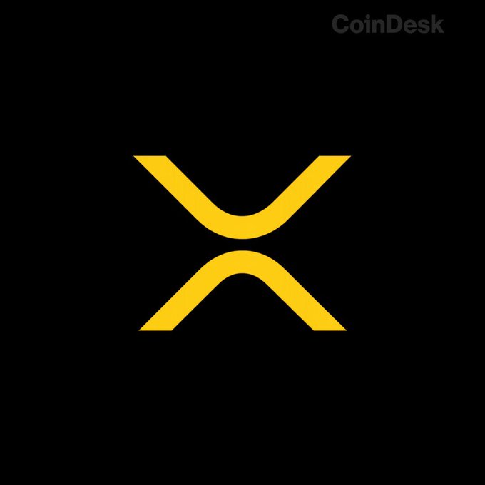 The yellow XRP cryptocurrency logo displayed on a black background, with 'CoinDesk' written in the top right corner.