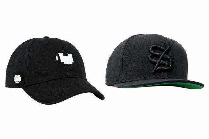 Two black baseball caps displayed side by side against a white background - one featuring pixel art designs and another with a stylized "S" embroidered logo.
