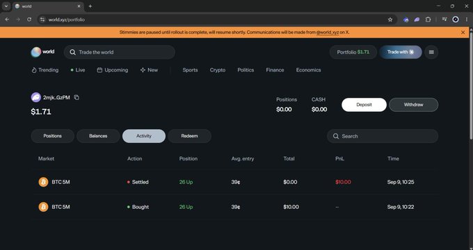A screenshot of the 'world' prediction market website (world.xyz) showing a portfolio activity tab with positions and balances of $0.00, displaying settled and bought BTC.SM markets, with an orange banner stating 'Slremmes are paused until rollout is complete...'