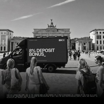 A black OKX-branded campaign truck advertising an "8% DEPOSIT BONUS" drives past the Brandenburg Gate in Berlin, promoting the crypto exchange's new offer as pedestrians walk by. The image ties into the post by showing one of the OKX campaign trucks spotted across Europe ahead of the MiCA transition.