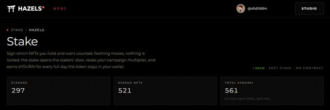A dark-themed webpage from Hazels Web3 showing a "Stake" dashboard for NFTs, displaying 297 stakers, 521 staked NFTs, and 561 total $VOURAI, with a description explaining that stakers raise a campaign multiplier to earn rewards.
