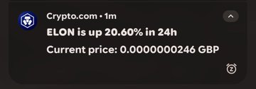 A Crypto.com notification showing 'ELON is up 20.60% in 24h' with a current price of 0.000000246 GBP.