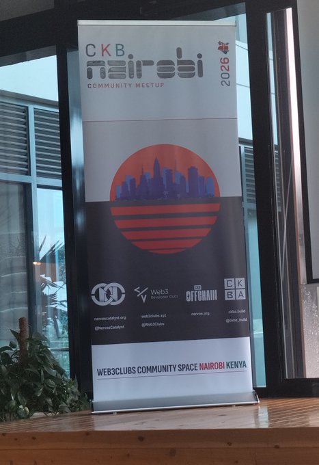 A vertical banner for 'CKB Nairobi Community Meetup 2026' displayed indoors, featuring a red circle with a city skyline silhouette and logos for Nervos, Web3 Developer Club, and Offchain.