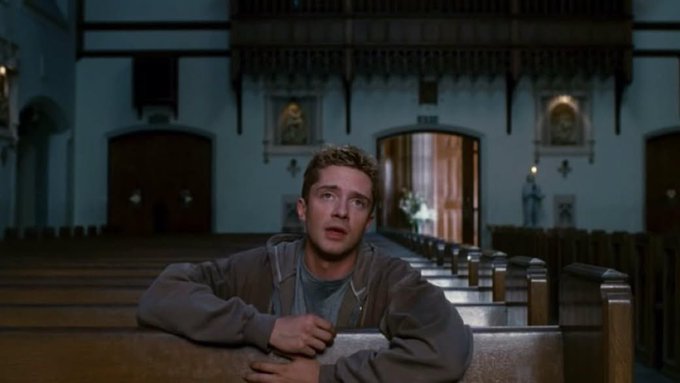 A young man kneels in a church, a scene that visually interprets the prayer for a "50k mcap meme to valhalla" to achieve wealth.
