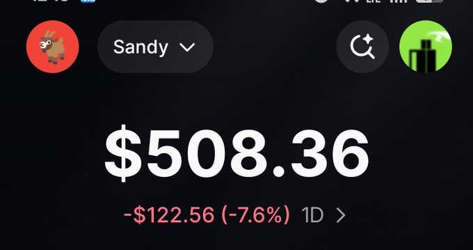A Robinhood trading screenshot for user "Sandy" showing a portfolio value of $508.36, down $122.56 (-7.6%) in the last day. The image relates to the post by promoting an Instagram follow-to-win giveaway, likely leveraging the trading app interface to attract followers with money-related content.