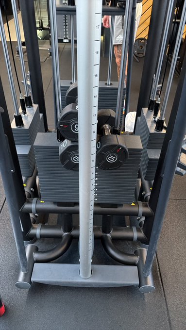 A weight stack machine at the gym with plates marked "10" and numbered settings ranging from 12-17, fitting the "GM. Early gym friends" post as a typical scene from an early morning workout session.