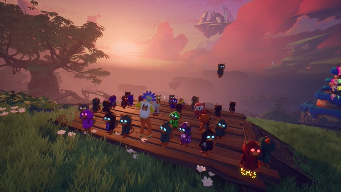 A group of cute, colorful creatures gather on a wooden platform at sunset in a vibrant video game world.
