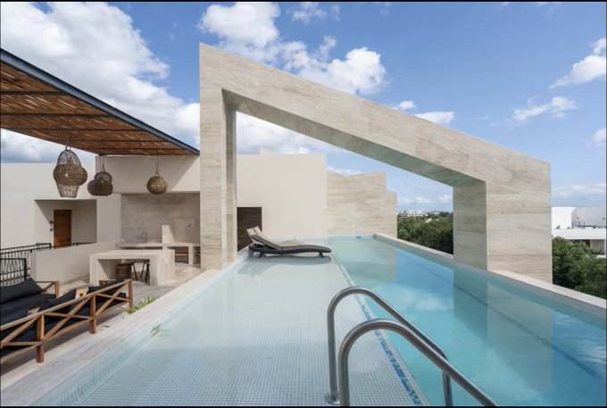 A modern rooftop pool features a striking infinity edge overlooking a cityscape, framed by a large stone archway and shaded lounge area.

The image of a luxurious, seemingly timeless rooftop pool contrasts with the post's message about crypto experience since 2018—suggesting that while the pool's architecture appears stable and inviting, the accompanying text emphasizes that their credibility is built on weathering volatile market cycles, not flashy appearances.