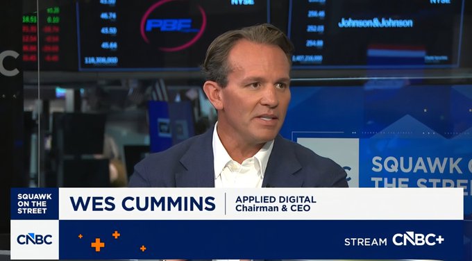 Wes Cummins, Chairman & CEO of Applied Digital, appears on CNBC's "Squawk on the Street," as the chyron displays his name and affiliation against a backdrop of stock tickers including NYSE and Johnson & Johnson. The image supports the post's commentary celebrating Cummins as a top-performing CEO driving Applied Digital's ($APLD) growth and ongoing deals with $CRWV.