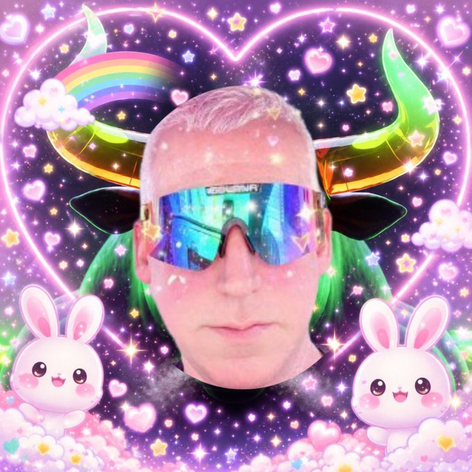 A man's face wearing iridescent sunglasses, edited with vibrant rainbow horns, a neon heart, sparkles, and cute pink bunny stickers on a cosmic background.