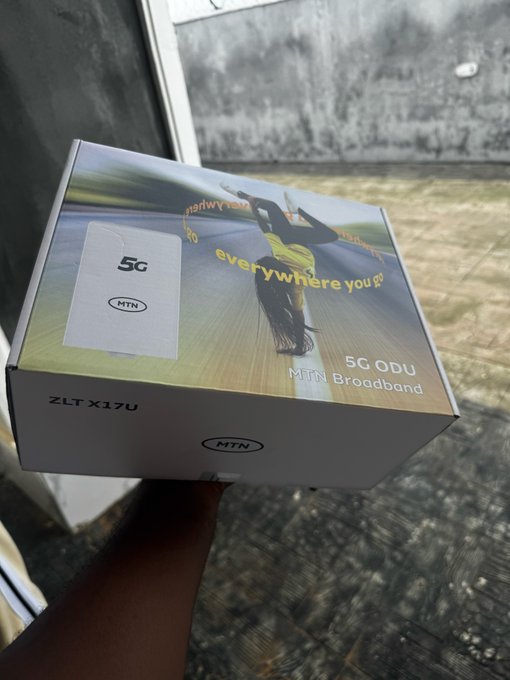 A person holds up a box for an MTN 5G ODU Broadband device (ZLT X17U), featuring the tagline 'everywhere you go.'