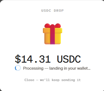 A screenshot of a USDC crypto drop notification showing a $14.31 USDC reward with a gift icon and a status reading 'Processing — landing in your wallet…'.