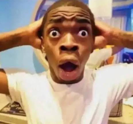 A man with a shocked expression holds his hands to his head in disbelief, perfectly capturing the exaggerated hype of meme coin trading on socialfi platforms. The image humorously reflects the post's commentary on over-the-top reactions to new token names and tickers being hyped in crypto communities.