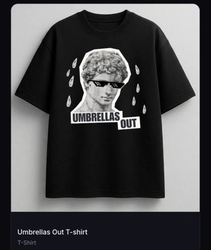 A product listing for a black 'Umbrellas Out T-Shirt' featuring a graphic print of a person with curly hair wearing sunglasses surrounded by umbrellas.