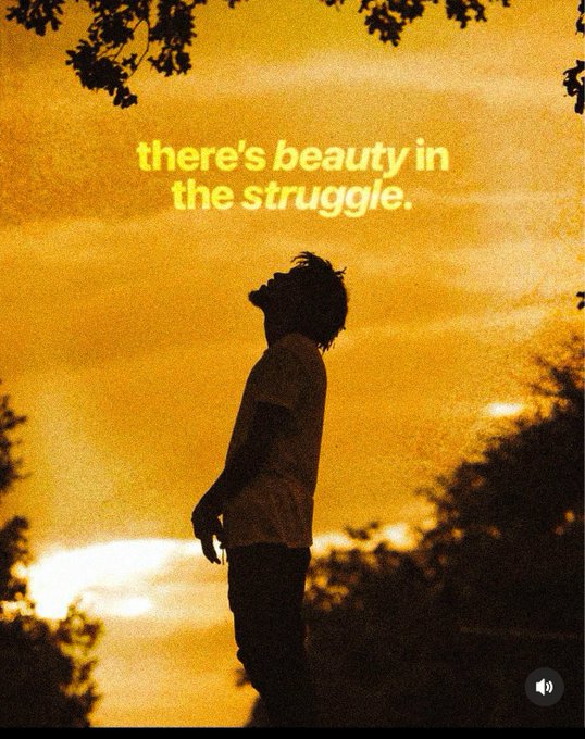 A silhouette of a person looking up against a golden sunset, overlaid with the text 'there's beauty in the struggle.'