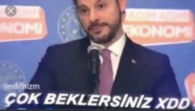 A meme image showing a man in a suit at a podium with Arabic text banners behind him, captioned 'ÇOK BEKLERSİNİZ XDD' with a watermark 'edithizm'.