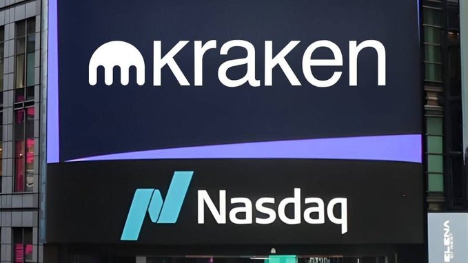 A large digital billboard displays the Kraken logo above the Nasdaq logo, indicating the cryptocurrency exchange's market presence.