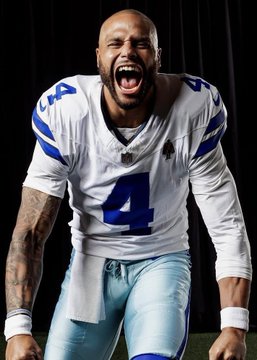 A Dallas Cowboys player wearing jersey number 4 passionately screams during a game, representing the team's intensity as a bettor places a $244,000 wager on Dallas to win against New York, potentially earning $400,000 on Polymarket.